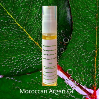 pure Moroccan argan oil, product image of oil bottle against a green leaf background with hints of lilac