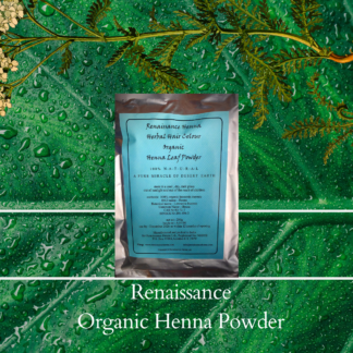 Organic henna hair colour powder in foil packet with blue label , displayed against a green leaf and plant background