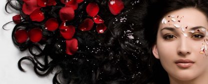 Natural Hair Dye Indigo for Black Hair Colour. Rose Petals in Long, Flowing Black Hair, Hair Dyed with Natural Hair Dye
