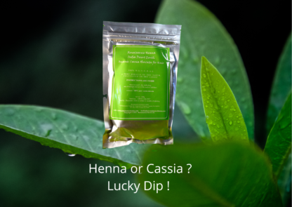 Henna cassia product packet, sealed foil pouch with green colour label displayed against green leaves background