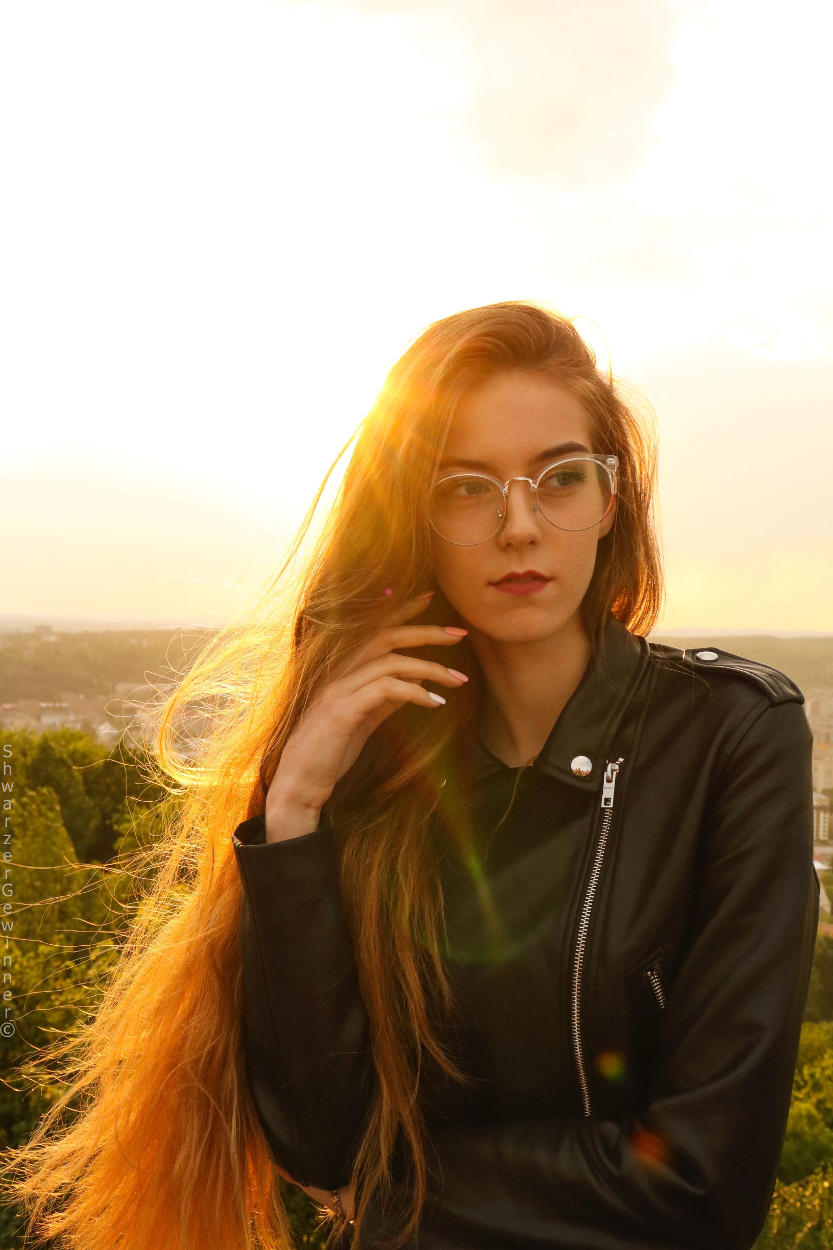 How to Make your hair grow with natural hair products, photo of girl wearing glasses ,with long straight hair
