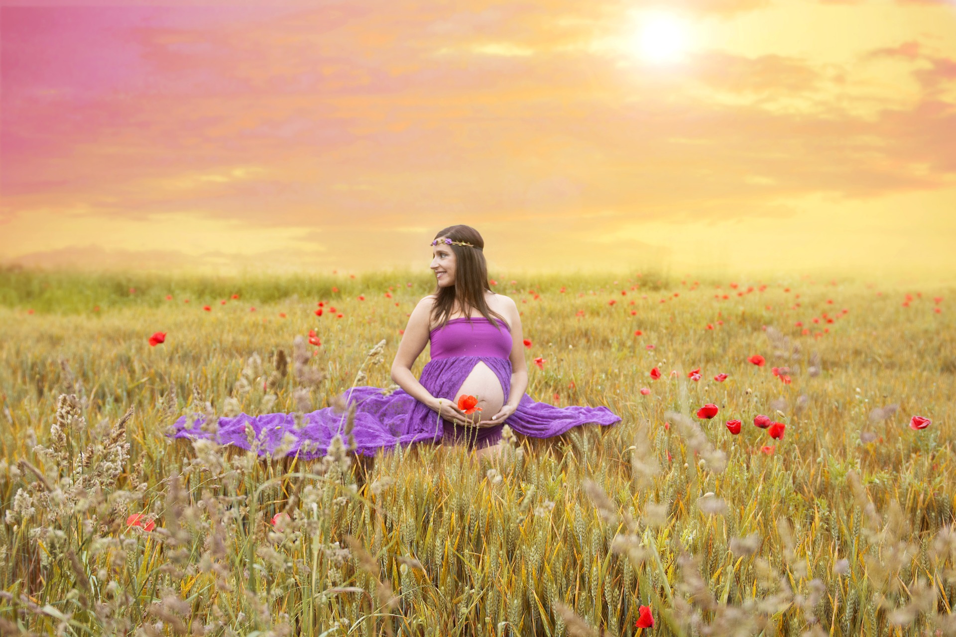 pregnancy and hair dyes, picture of pregnant mother sitting in a field of flowers
