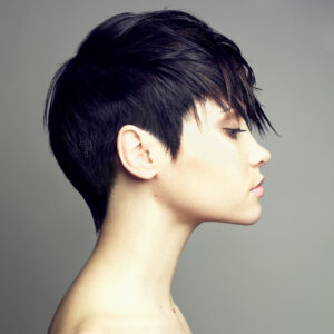 hair dye for sensitive scalp and for PPD hair dye allergy - profile image of model's head with short black hair and sharp fringe cut over her forehead 