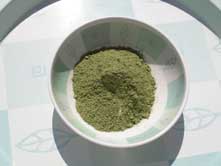 Close-up of pure indigo powder in a small bowl
