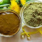Small glass bowls showing henna powder and freshly mixed henna paste with yellow dandelion background
