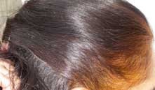 Maryam hennaed hair tied back