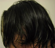 David's side view indoors showing glossy dark brown-black hair after henna and indigo