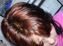Dee's hair top view with middle parting after henna and indigo
