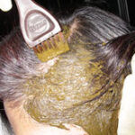 Side view of Maryam applying Henna, showing the side and top sections